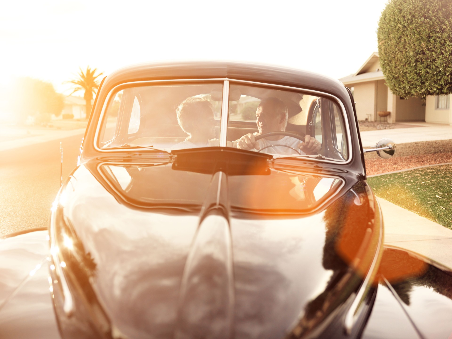 senior couple with vintage car